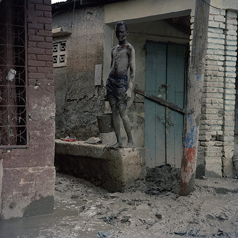 Drowning World: Haiti - Climate Change - Removing mud after flooding