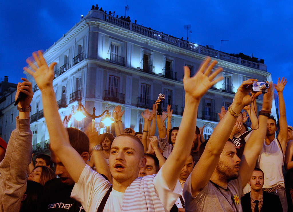 Protesters shout slogans in Madrid's Puerta del Sol
