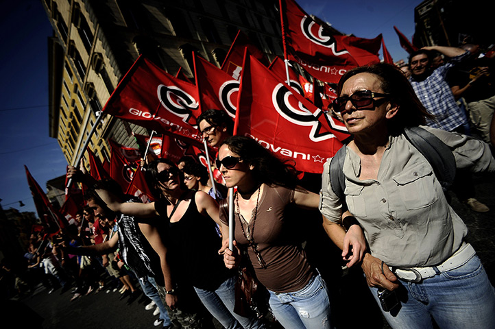 24 hours: Rome, Italy: Demonstrators wave flags at a protest against the government