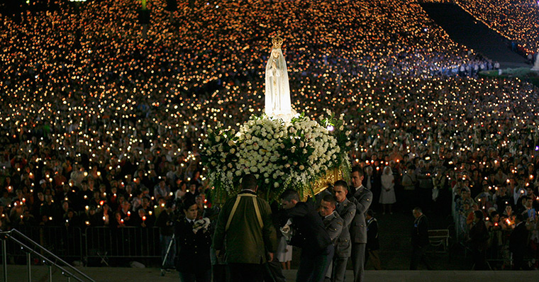 24 hours: Portugal: A statue of the Holy Virgin Mary of Fatima is carried