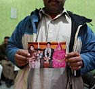 Relative holds a picture of Faizan Haider, a 21-year-old Pakistani killed by CIA agent Raymond Davis