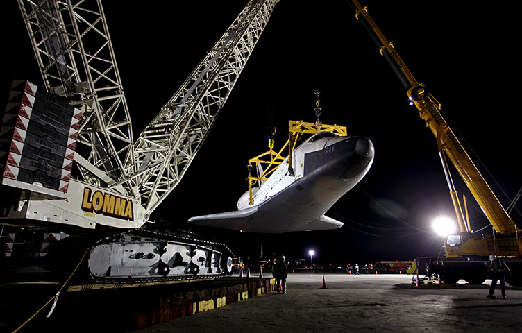 24 hours: New York, US: The space shuttle Enterprise hangs in the air at JFK airport