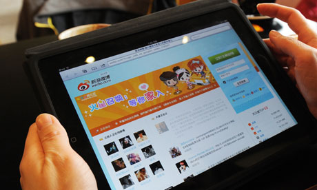 A woman views the Chinese social media w