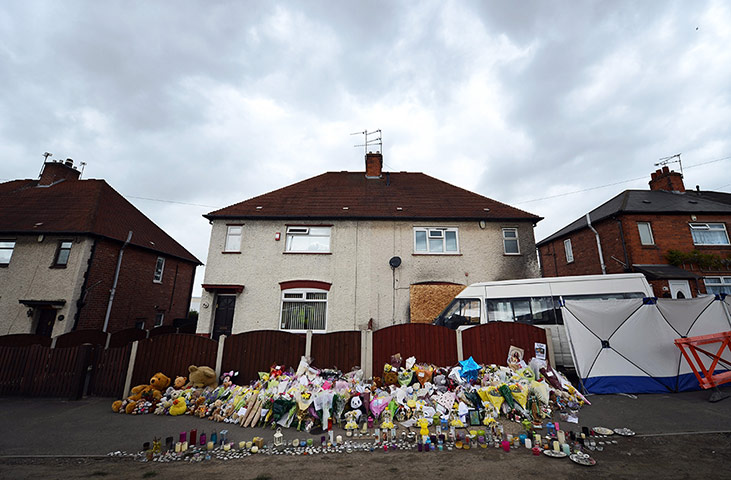 Picture desk live: Floral tributes at the house in Derby where six children died in a fire