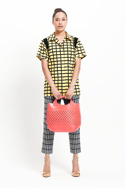 All Ages: All Ages, Genevieve wears black and white patterned trousers.