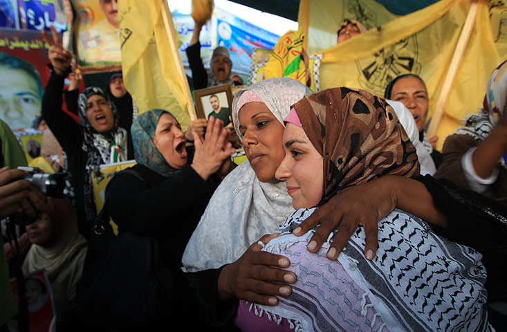 Picture desk live: Relatives of prisoners celebrate an end to their hunger strike in Gaza