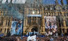 Manchester City supporters paint town blue as history boys go on parade | UK news