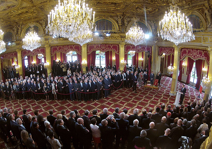 Hollande investiture : President Francois Hollande, right, speaks during the handover ceremony