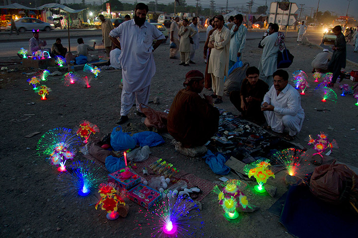 24 hours: Rawalpindi, Pakistan: Vendors sell Chinese-made toys 