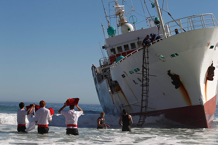 Picture desk live: Pizza is delivered to the Japanese trawler aground off Cape Town