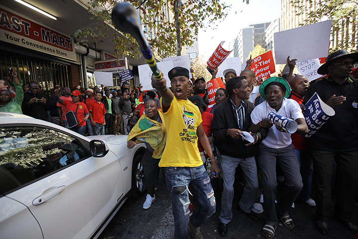 Picture desk live: Members of South Africa's trade union, COSATU clash with DA supporters 