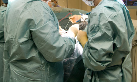 Neurosurgeons operation on a patient