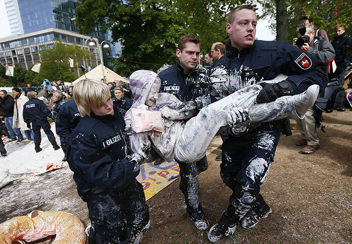 Picture desk live: Police carry a demonstrator from the Occupy camp in Frankfurt