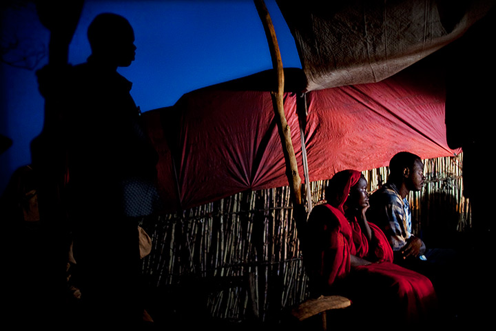 24 hours: Unity State, South Sudan: Refugees gather around a small TV set