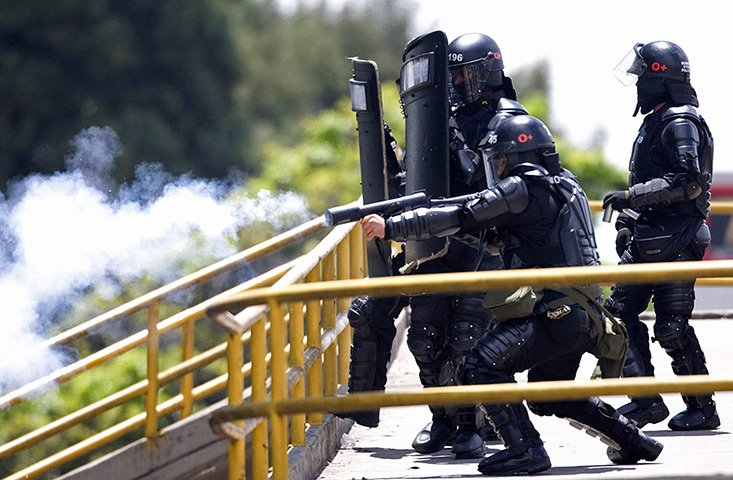 24 hours: Bogota, Colombia: Riot police fire tear gas toward students 