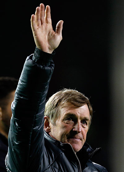 Kenny Dalglish: Liverpool's manager Dalglish waves to the crowd 