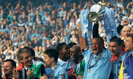 Vincent Kompany lifts the Premier League trophy