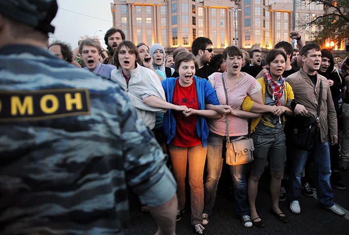 24 hours in pictures: Russian riot policemen detain protestors during a rally in central Moscow