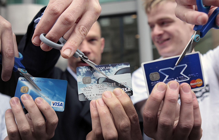 Week in business: Angry Lloyds customer cut up their bank card outside the bank's AGM