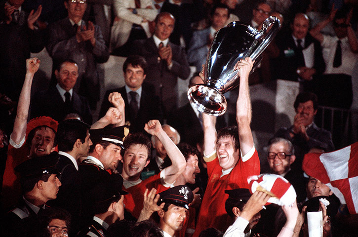 England v Germany: Liverpool captain Emlyn Hughes lifts the European Cup trophy in 1977