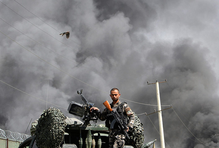 Picture desk live: Kabul is rocked by explosions after Barack Obama's visit