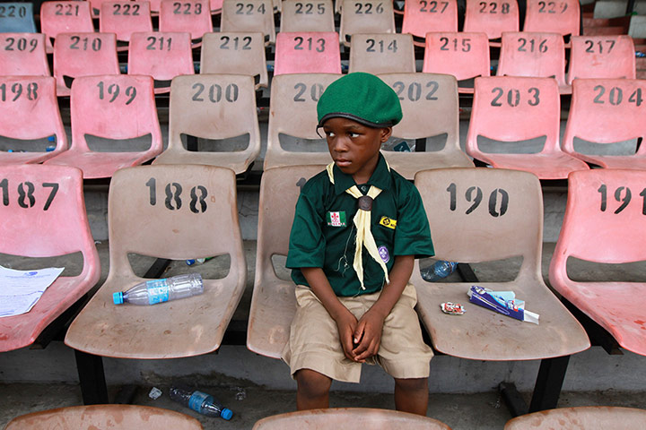 Picture desk live: A scout sits after a parade in Lagos, Nigeria