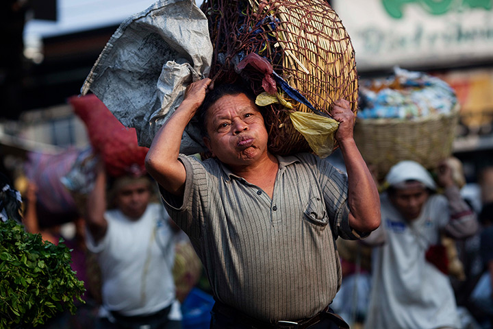 24 hours: Guatemala City, Guatemala: Workers, known as cargadores, carry vegetables