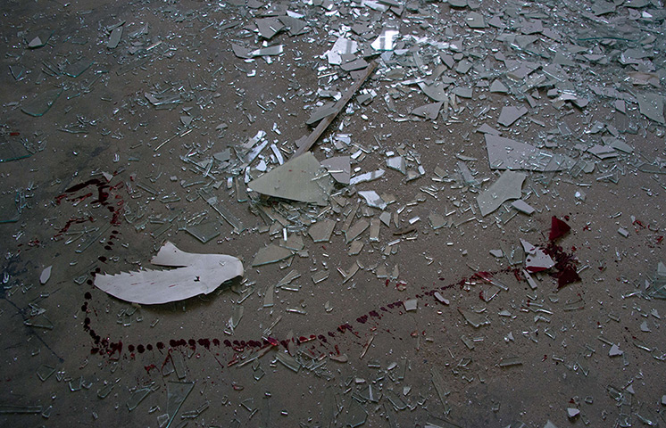 24 hours: Kabul, Afghanistan: A trail of blood after a a suicide bomb attack 