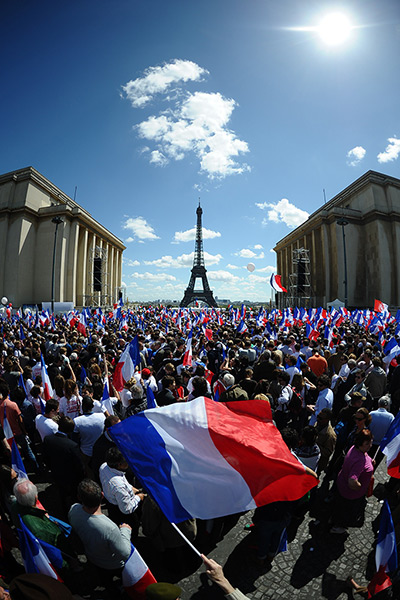 24 hours: Paris, France: Supporters wave flags during presidential election campaign