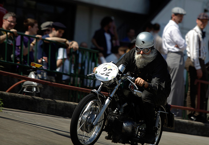 24 hours: Budapest, Hungary: An elderly man rides his motorbike at a velodrome