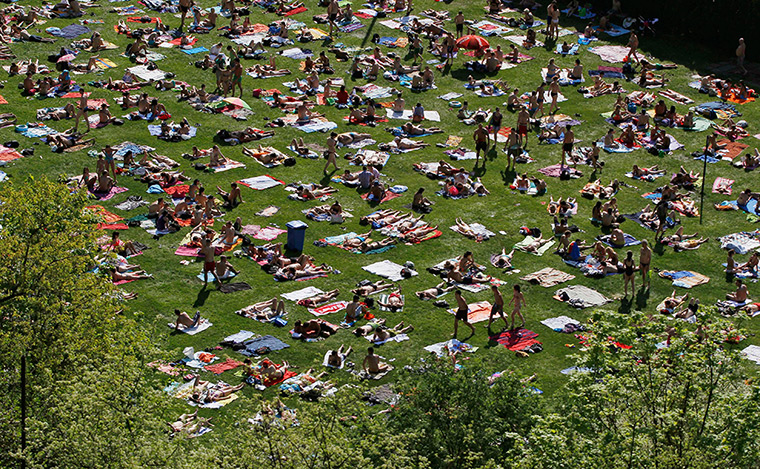 24 hours: Prague, Czech Republic: People enjoy unusually warm weather at a pool 
