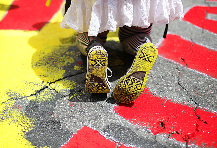 24 hours: San Francisco, California, US: Yellow paint on shoes of an Occupy protester