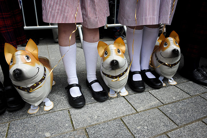 Picture desk live: School children wait to meet the Queen in Exeter
