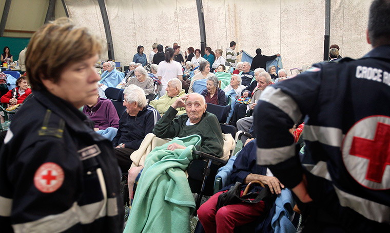 earthquake in italy: Elderly people receive first aid after an earthquake in Finale Emilia