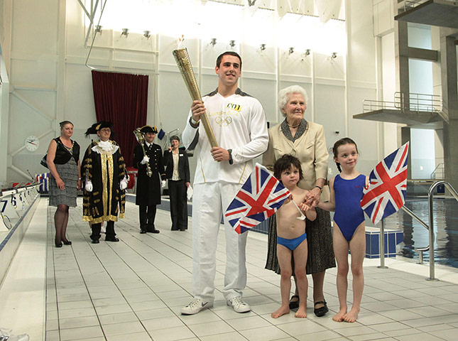 Torch relay day 2: Torchbearer 001 Jordan Anderton with Audrey Uglow
