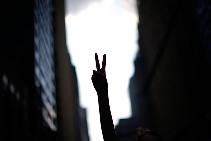 24 hours: A demonstrator gestures during a protest before the start of a NATO summit