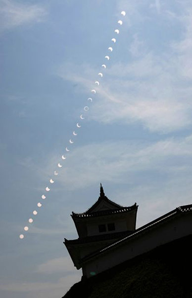 eclipse: A multiple exposure showing the progress of the eclipse over Utsunomiya