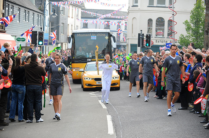 Olympic torch relay day 3: Georgina Geikie carrying the Olympic Torch between Okehampton and Merton
