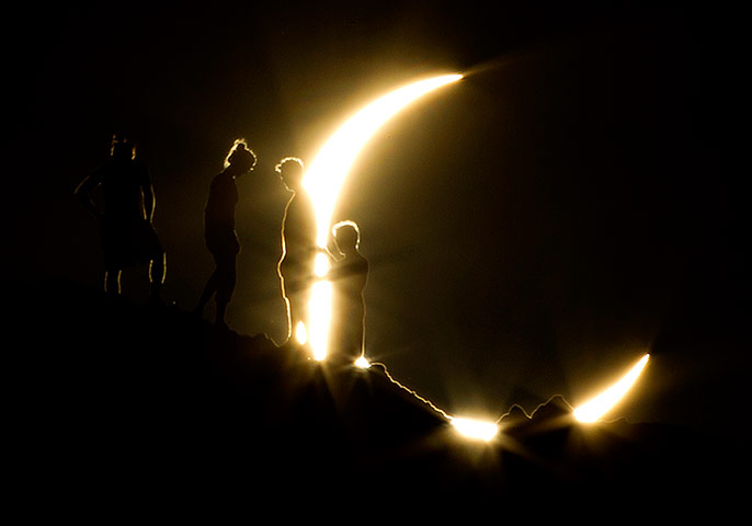 Picture desk live: Hikers watching the solar eclipse in Phoenix, Arizona