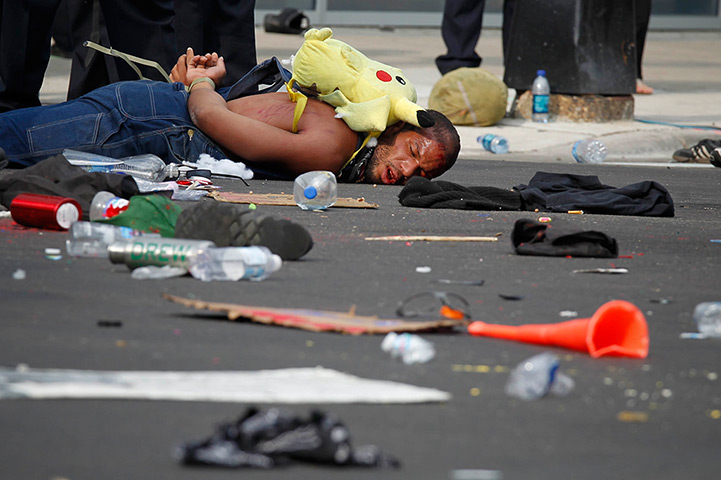 NATO summit protests: A protester lies detained after clashing with police in Chicago