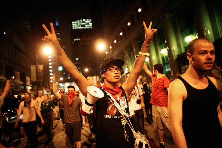 NATO summit protests: Demonstrators flash the peace sign