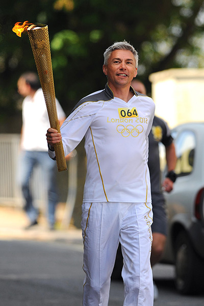 Olympic torch relay day 3: Jonathan Edwards carrying the Torch in Ilfracombe