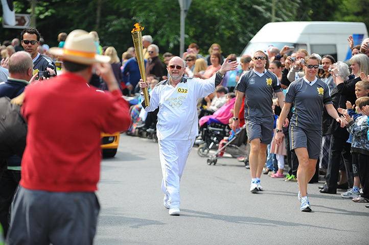 Olympic torch relay day 3: Duncan Withall carrying the Olympic torch between Torrington and Bideford