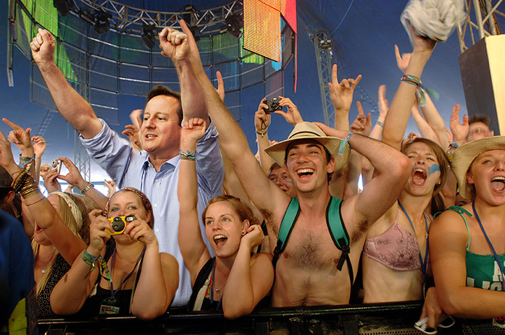 David Cameron celebrates: David Cameron with his arms in the air at Glastonbury
