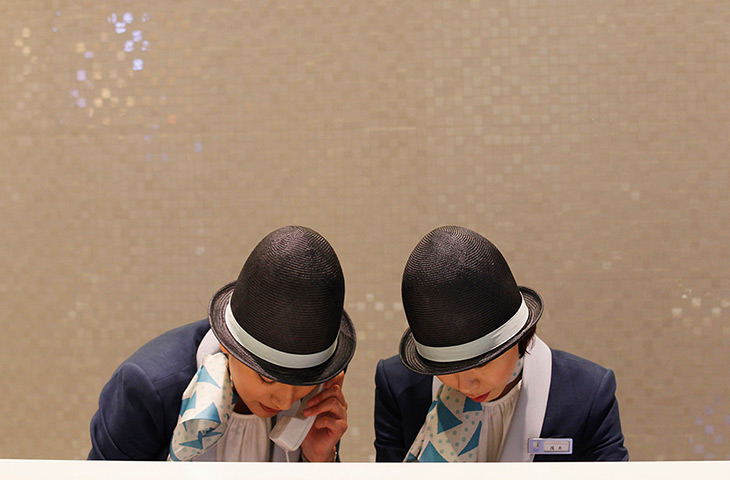 Tokyo Skytree tower opens: Receptionists work behind their desk 