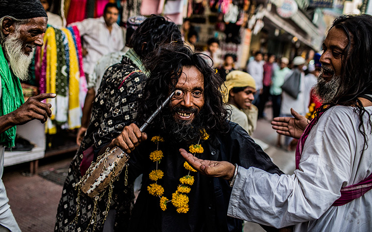 24 hours in pictures: A Sufi Muslim pilgrim self-flagellates during the 'Urs' Festival