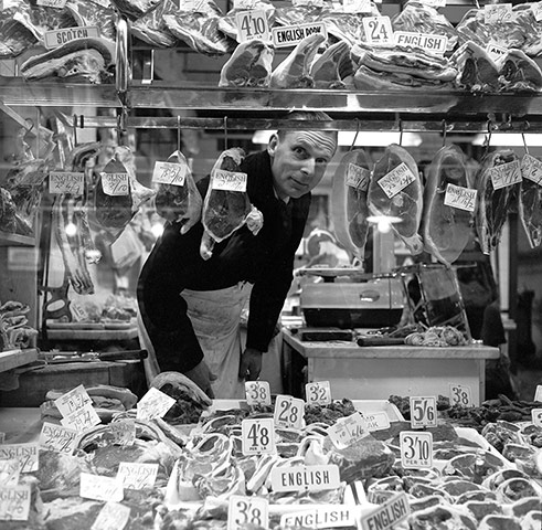 London Photographs: Butcher looking through his shop window
