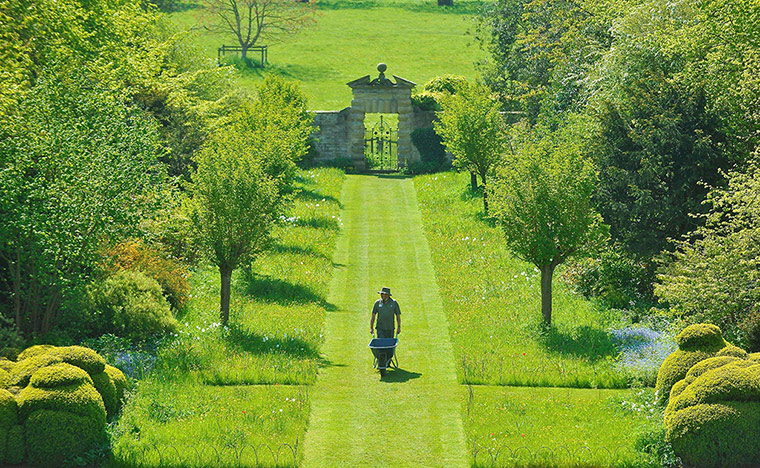 Picture desk live: Ian Gibbs works in the sunshine at Nunnington Hall 