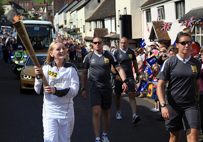 Olympic torch relay day 3: Torchbearer Katrina Doyle runs through Dunster near Minehead