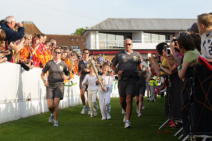 Olympic torch relay day 3: Thomas Pearce carries the Olympic flame on the leg through Taunton